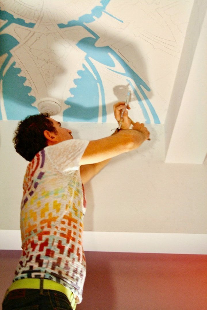 XAVI painting Mushroom Cafe mural